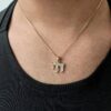 Lustrous 14K Gold Chai Pendant with Diamonds